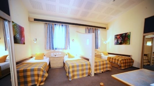 four beds at manta's divers rooms